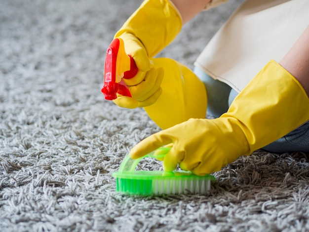 Free photo close-up disinfecting with cleaning supplies