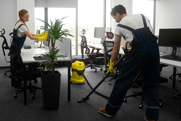 Free photo full shot people cleaning office