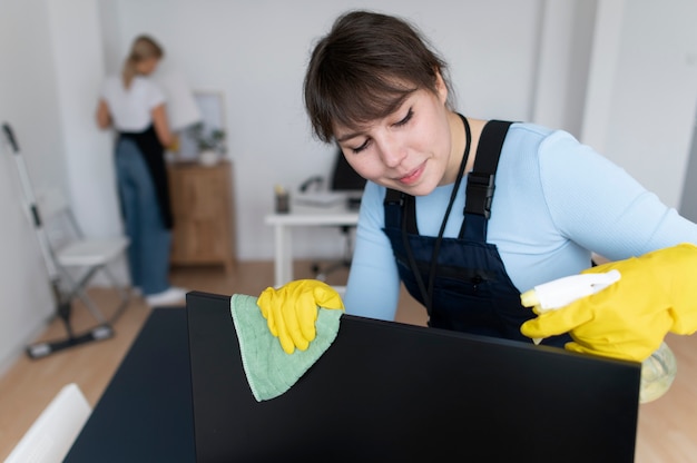 Free photo people taking care of office cleaning