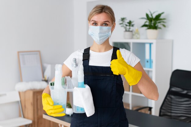 Free photo person taking care of office cleaning