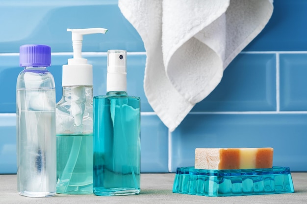 Free photo soap and toiletries on shelf in blue bathroom
