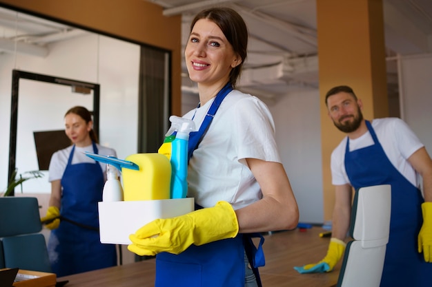 Free photo view of professional cleaning service person holding supplies