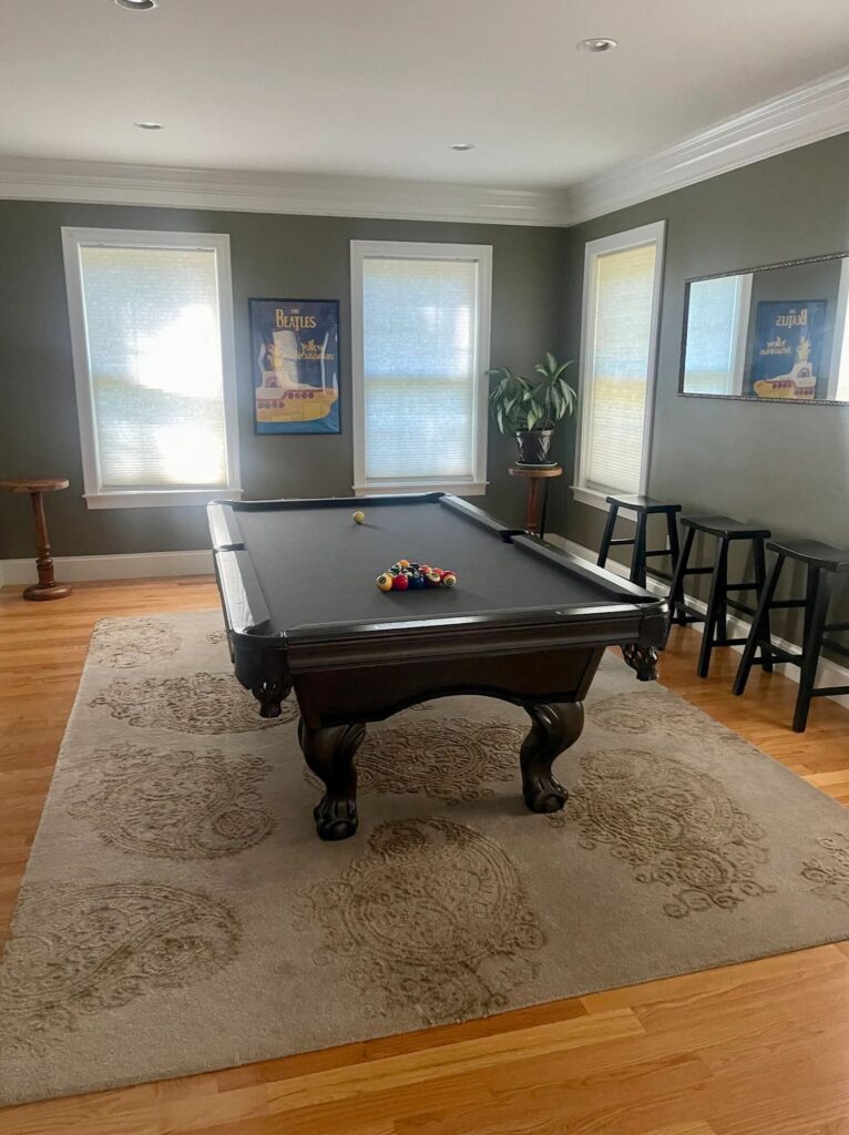 This stylish Newton game room got the BraBos treatment—dust-free, polished, and guest-ready.
