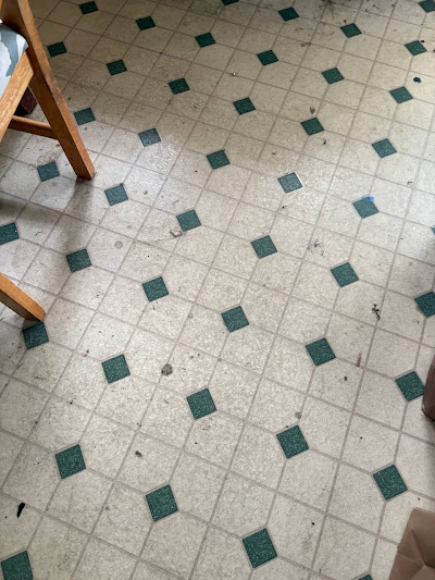 Before photo of the kitchen floor show the incredible transformation in Somerville