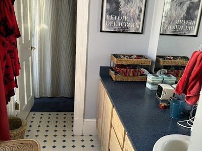 BraBos Cleaning staff member scrubbing a bathroom during professional cleaning in Cambridge MA